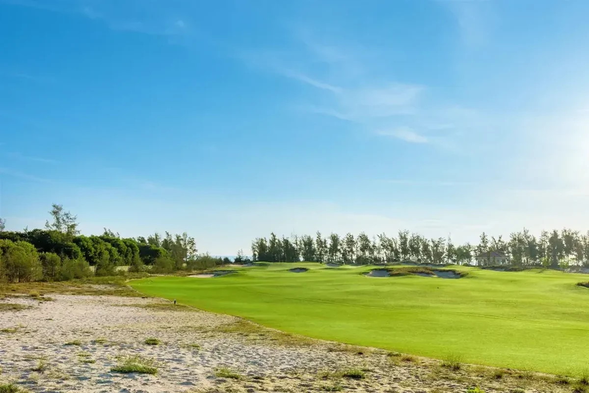 Golden Sands Golf Resort fairway and coastal dunes in Hue