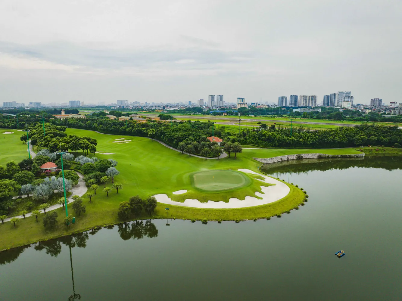 Island green and lake at Long Bien Golf Course