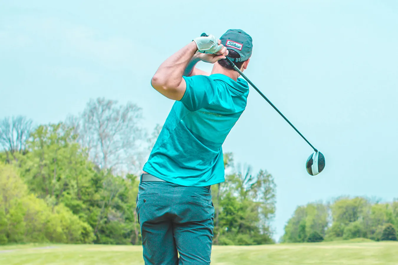 Golfer teeing off at Van Tri Golf Club