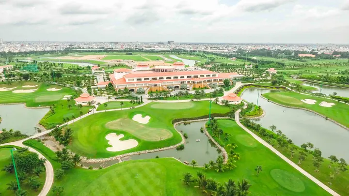 Aerial view of the clubhouse, water and golf holes at Tan Son Nhat Golf Course
