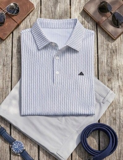 White pattern custom golf polo flatlay, corporate golf apparel