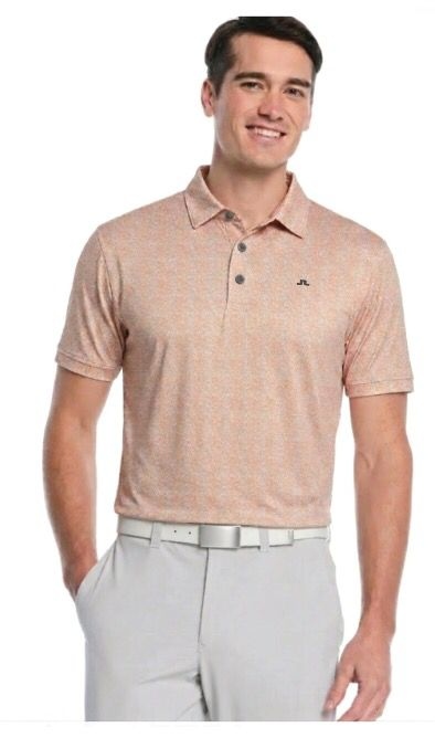 Custom orange golf polo on model, performance golf apparel Australia