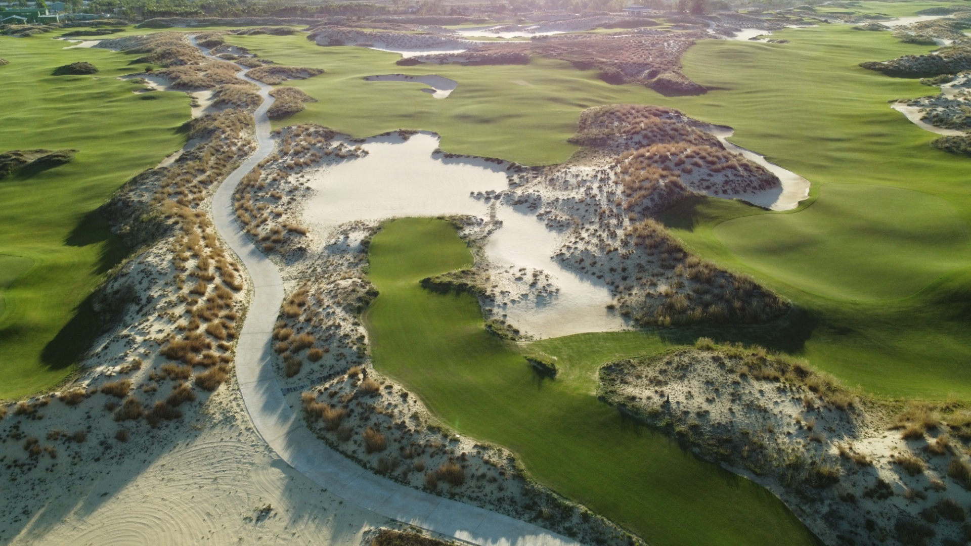 Aerial view of a championship links-style golf course on the Vietnamese coastline